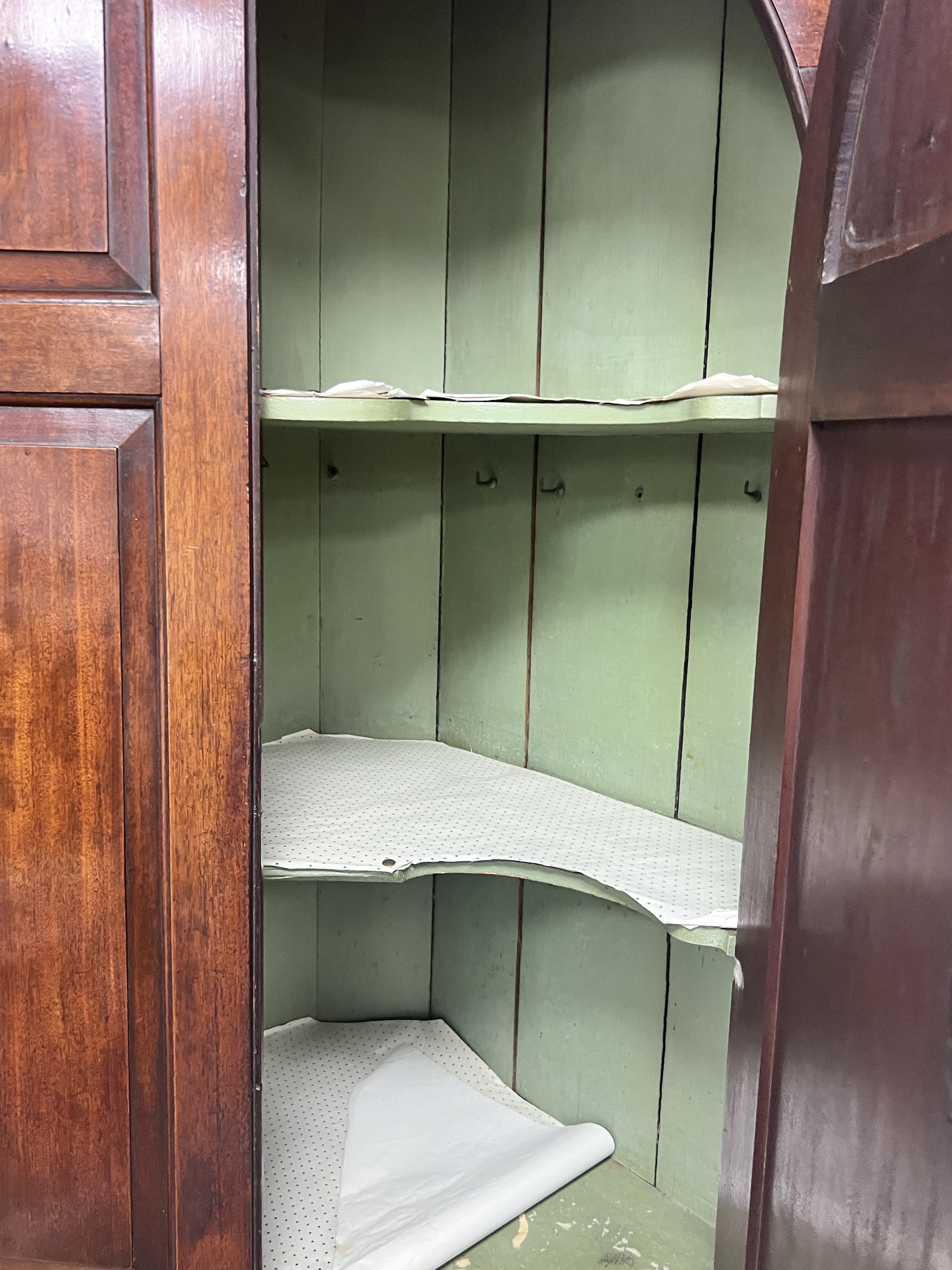 A George III mahogany standing corner cabinet, width 110cm, depth 56cm, height 228cm
